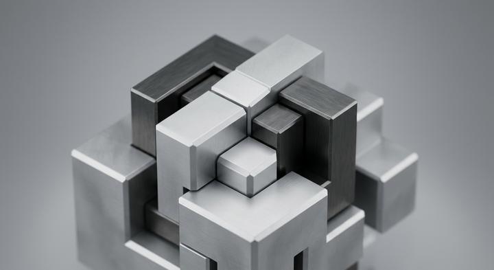 Abstract 3D render of precision geometric metal blocks signifying industrial mold design