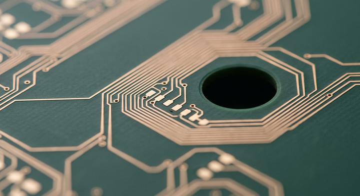 High-precision printed circuit board showing clean traces and thermal isolation cutouts