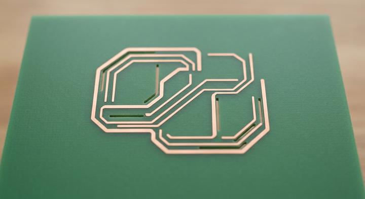 Minimalist PCB layout highlighting isolated copper traces and air-gap routing