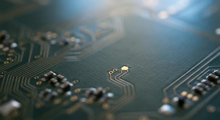 Close-up macro view of a high-precision printed circuit board layout showing clean traces