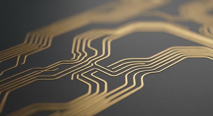 Abstract 3D render of a clean dark gray and gold printed circuit board layout showing precision routing.