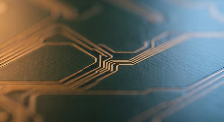 Close-up of a minimalist PCB with abstract warm and cool light representing thermal isolation