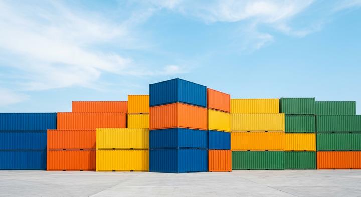 Minimalist and clean stacked cargo containers under a bright sky representing safe global logistics