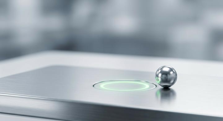 Abstract high-tech laboratory surface with safety green light indicating successful verification and quality control testing.